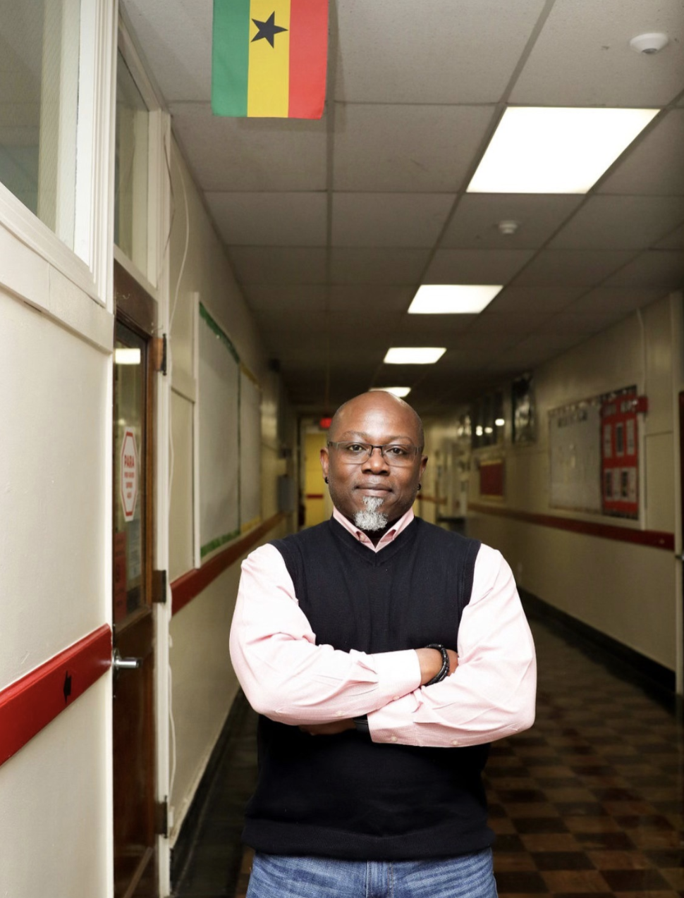 Dr. K. W. Asante in a school hallway